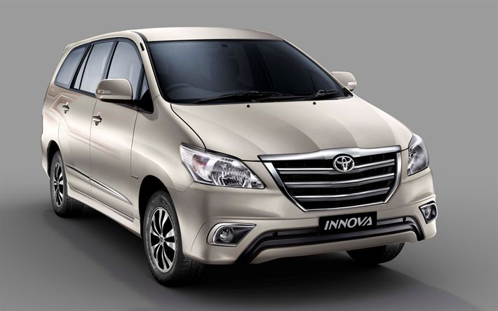 "Toyota Innova MPV in beige, a reliable and spacious vehicle ideal for family and commercial use."